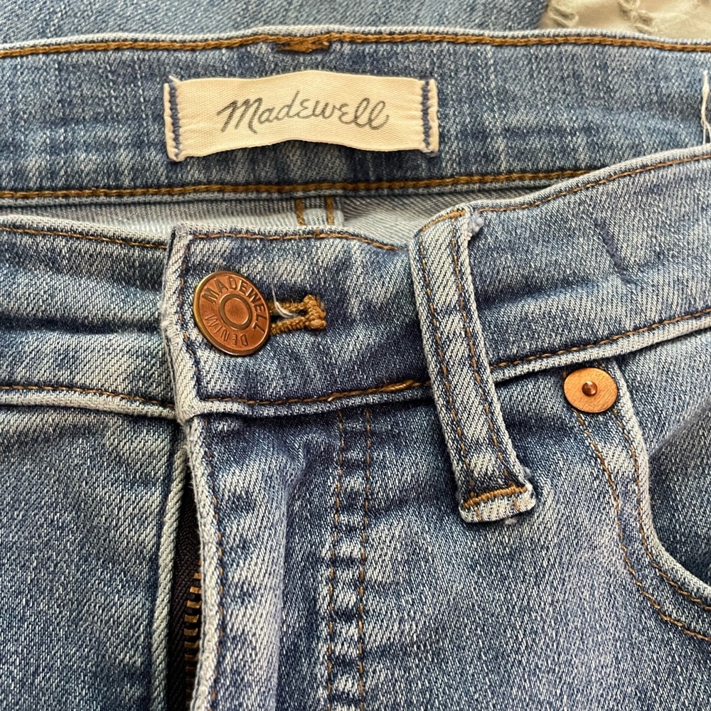 Madewell 9” high-rise skinny jeans with distressed features and knees cut out